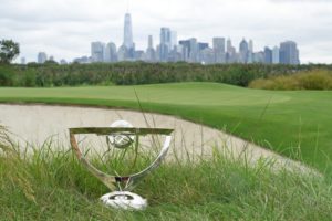 Photo of the trophy that is given at the Norther Trust Golf tournament in Liberty Nation Golf Course. This picture has a skyline view of lower Manhattan in the background.