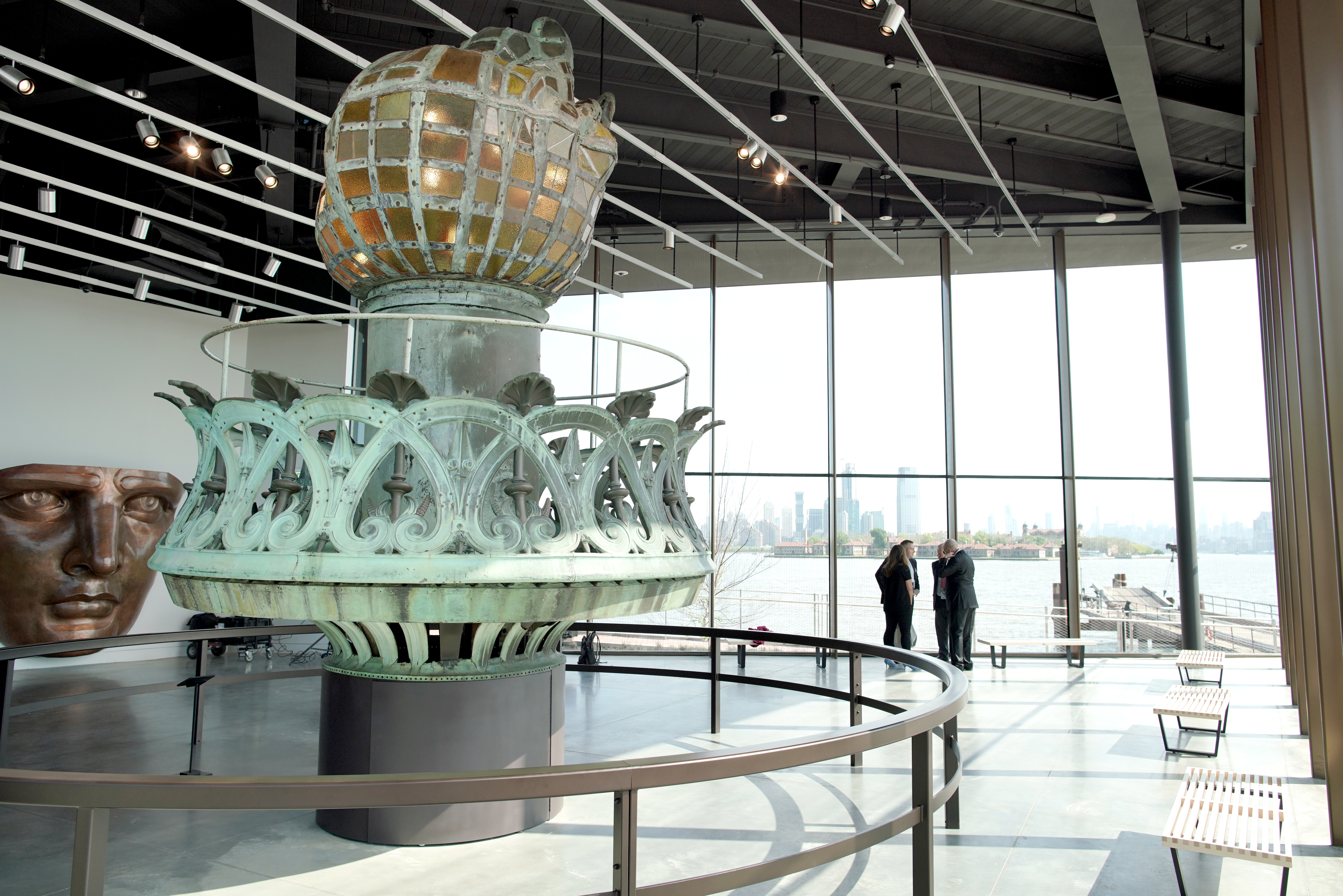 Inside the Statue of Liberty Museum where the original torch sit in the center of the room