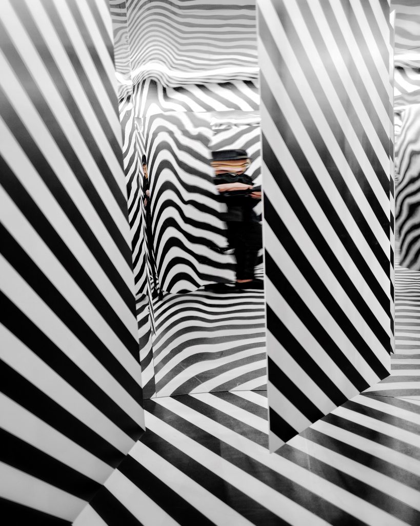 art installation of black and white striped walls