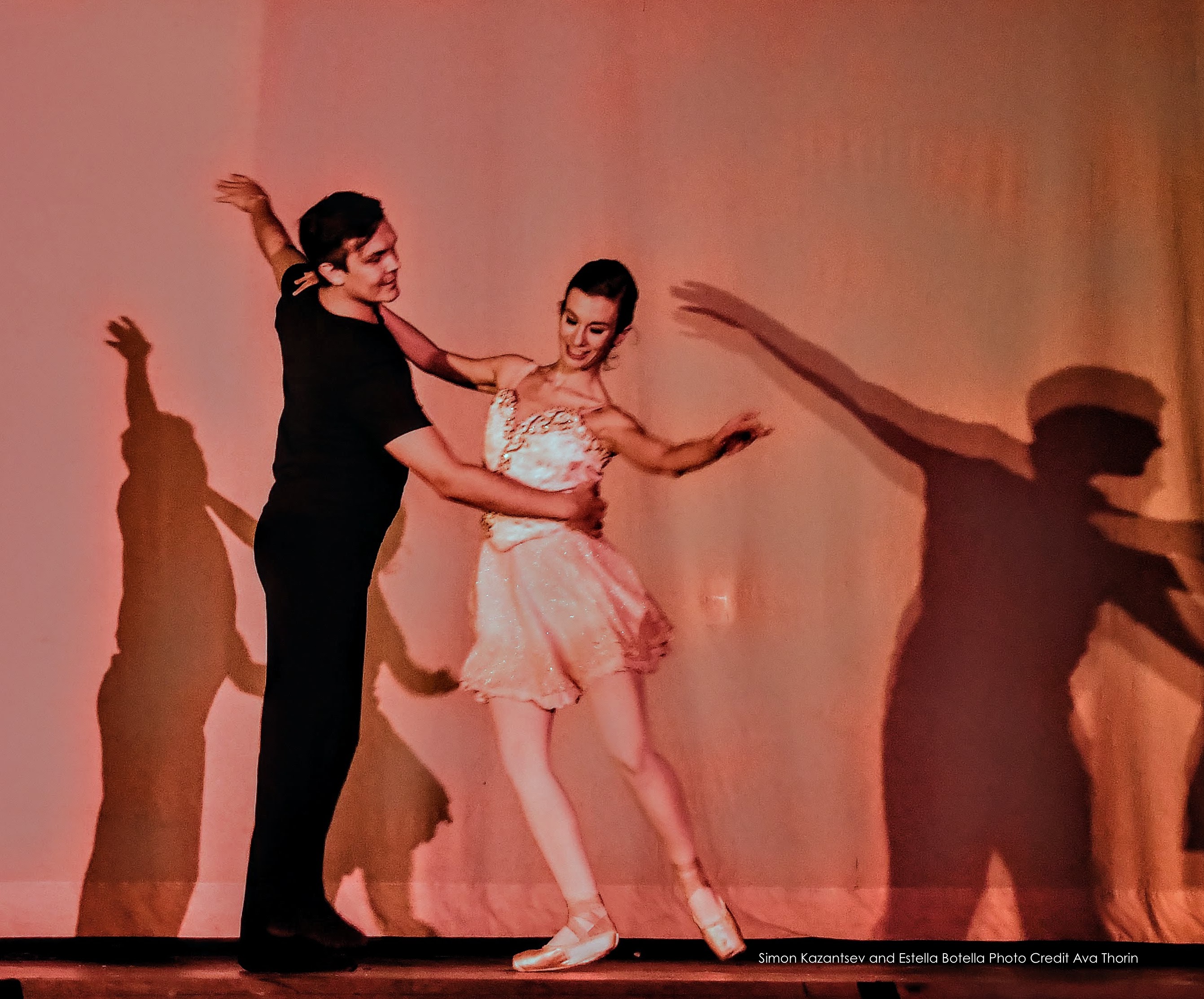 male dancer and ballerina performing on stage