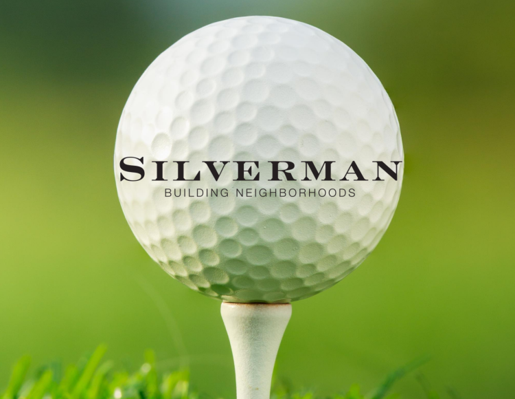 golf ball with text "Silverman building neighborhoods"