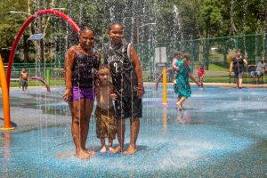 kids posing for picture in park water park