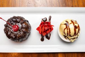 Dessert plate of chocolate cake and scoop of ice cream