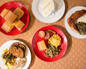 Assorted plates of dinner entrees and desserts