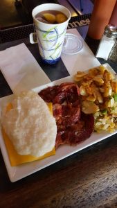 Cup of iced tea and plate of food 