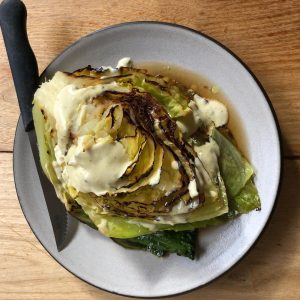 king cabbage over ham broth topped with aioli