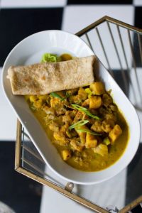 plate of stew and roti