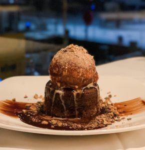 chocolate cake with a scoop of chocolate ice cream