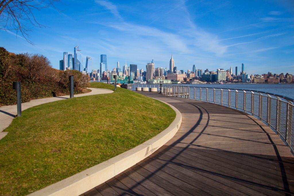Pier C Park pier with clear sky view of the Manhattan skyline