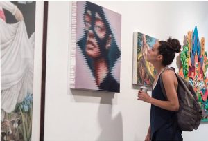 woman looking at art at gallery