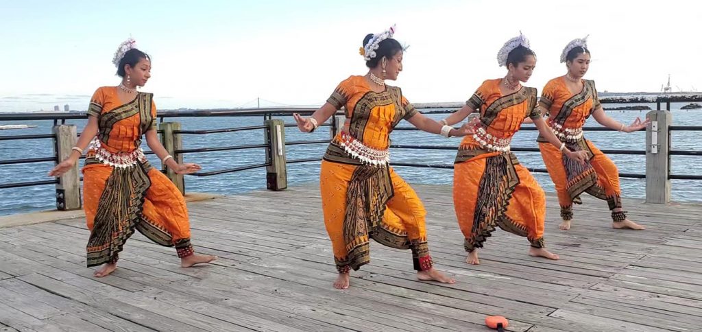 group of Surati Dancers performing on the pier