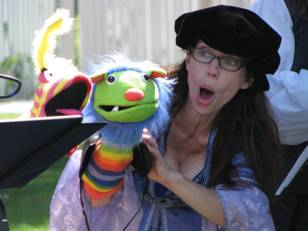 woman doing puppet show