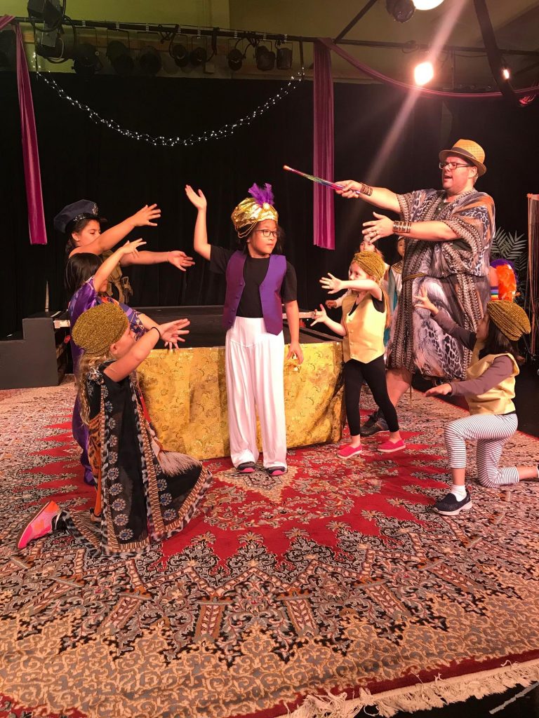 children performing a play