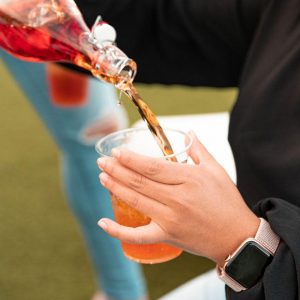 Alcohol being poured into a cup