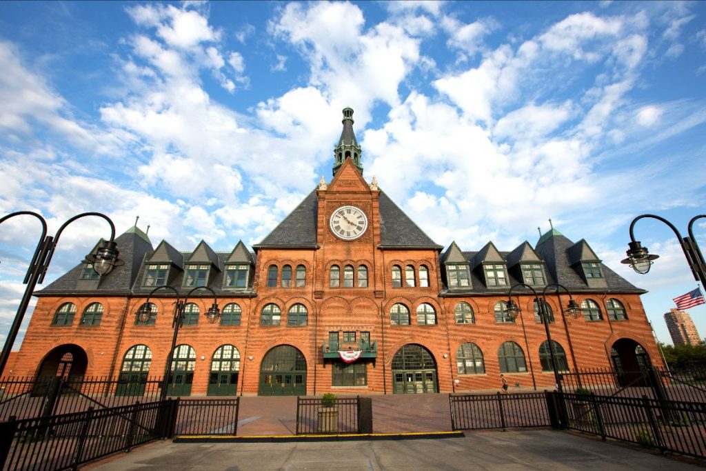 An image of the front building of the Central Railroad of New Jersey Terminal with the sky in the background