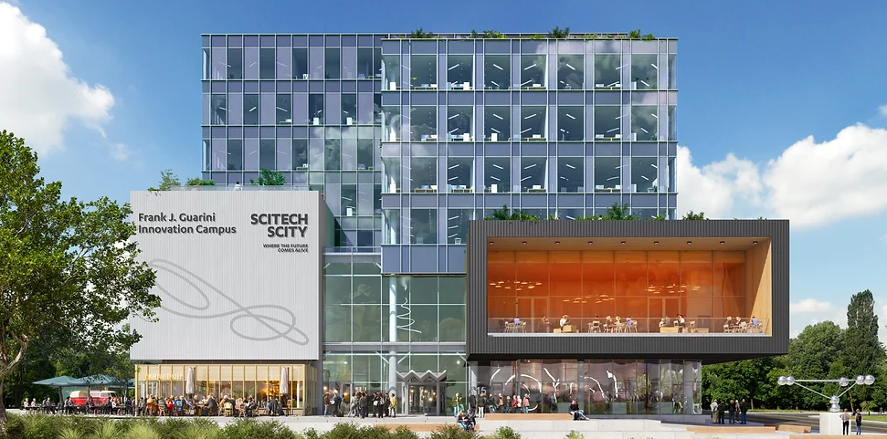 Image of the Liberty Science Center in Hudson, NJ on a beautiful sunny day and with the modern building shining brightly and people walking around