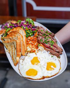 Breakfast platter with eggs, toast and sausage