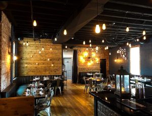 Interior of restaurant, rustic with low light