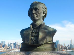 Bust of historic figure with the city skyline in the background