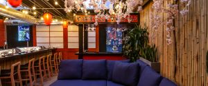 Inisde Sushi by Bou; Japanese decor and blue couch seating area