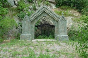 Sybil's cave entrance; a pointed rock archway 