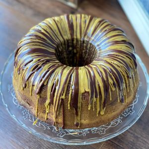 matcha bundt cake topped with chocolate and matcha icing 