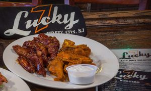 buffalo wing and a side of ranch next to a Lucky 7 tshirt