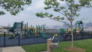 Children's green and yellow playground in Maxwell Place Park