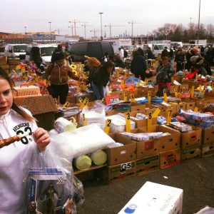 People looking through boxes of goods at the Meadowlands Market