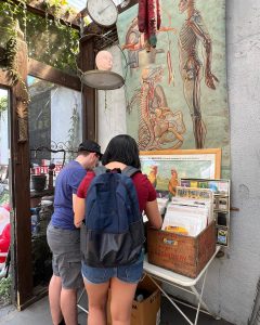 Man and woman flipping through records at Pacific Flea market