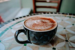 latte in a small green mug