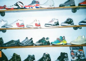 rows of sneakers on wall shelves