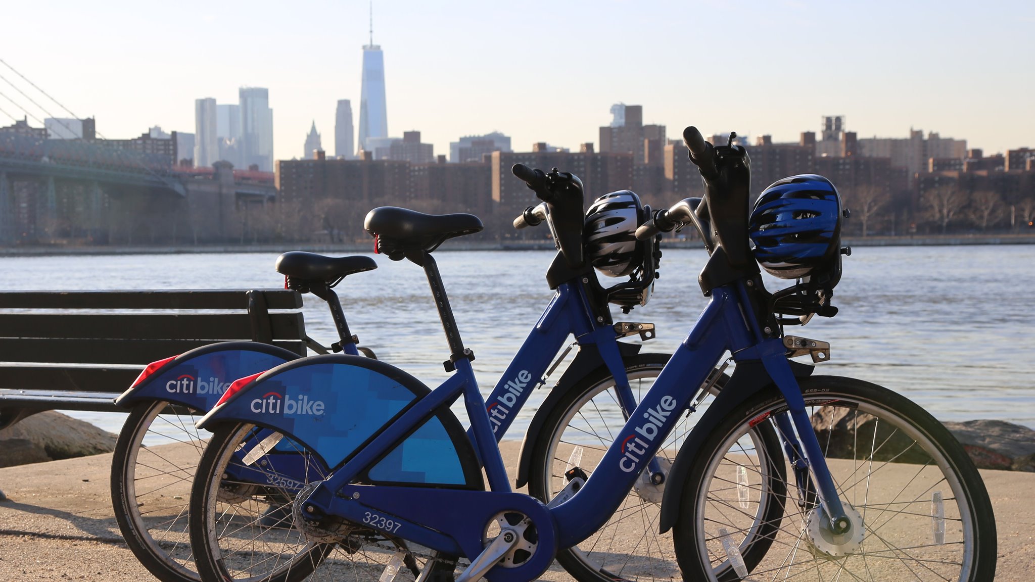 2 citi bikes parked on the waterfront
