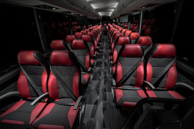 black and red seats inside a charter bus