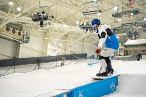 Man snowboarding at the indoor ski resort Big Snow