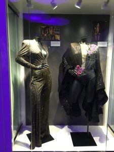 Costumes behind glass case at the Grammy Museum Experience